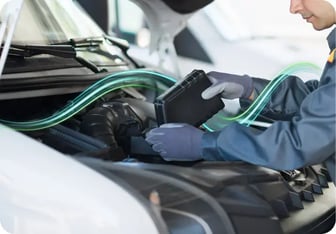 Mechanic performing maintenance on a van