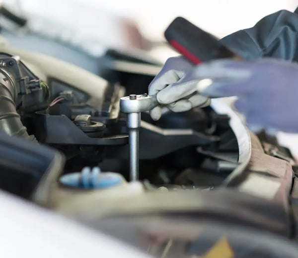 Vehicle engine undergoing maintenance