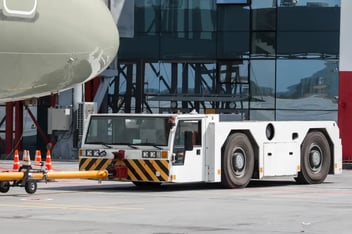 tow-truck-pushes-passenger-jet-plane