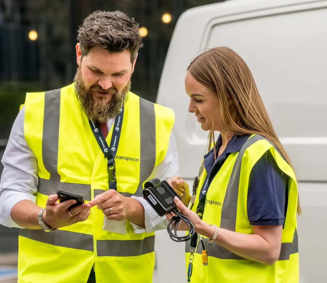 two people looking at device in one persons hand